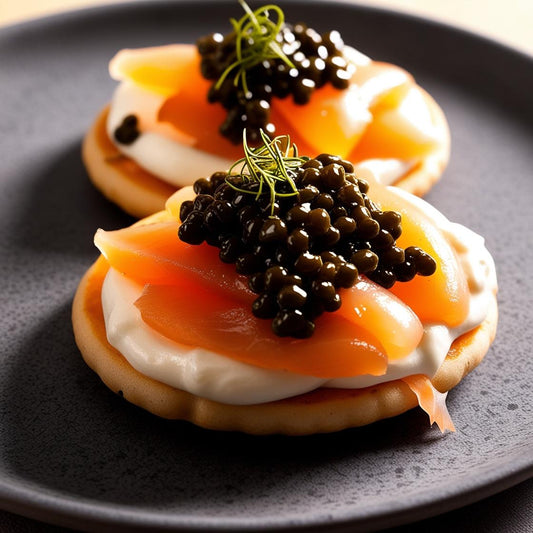 Blini topped with crème fraîche, lox, and black caviar, a luxurious appetizer perfect for gourmet dining, caviar gift sets, and celebrations.